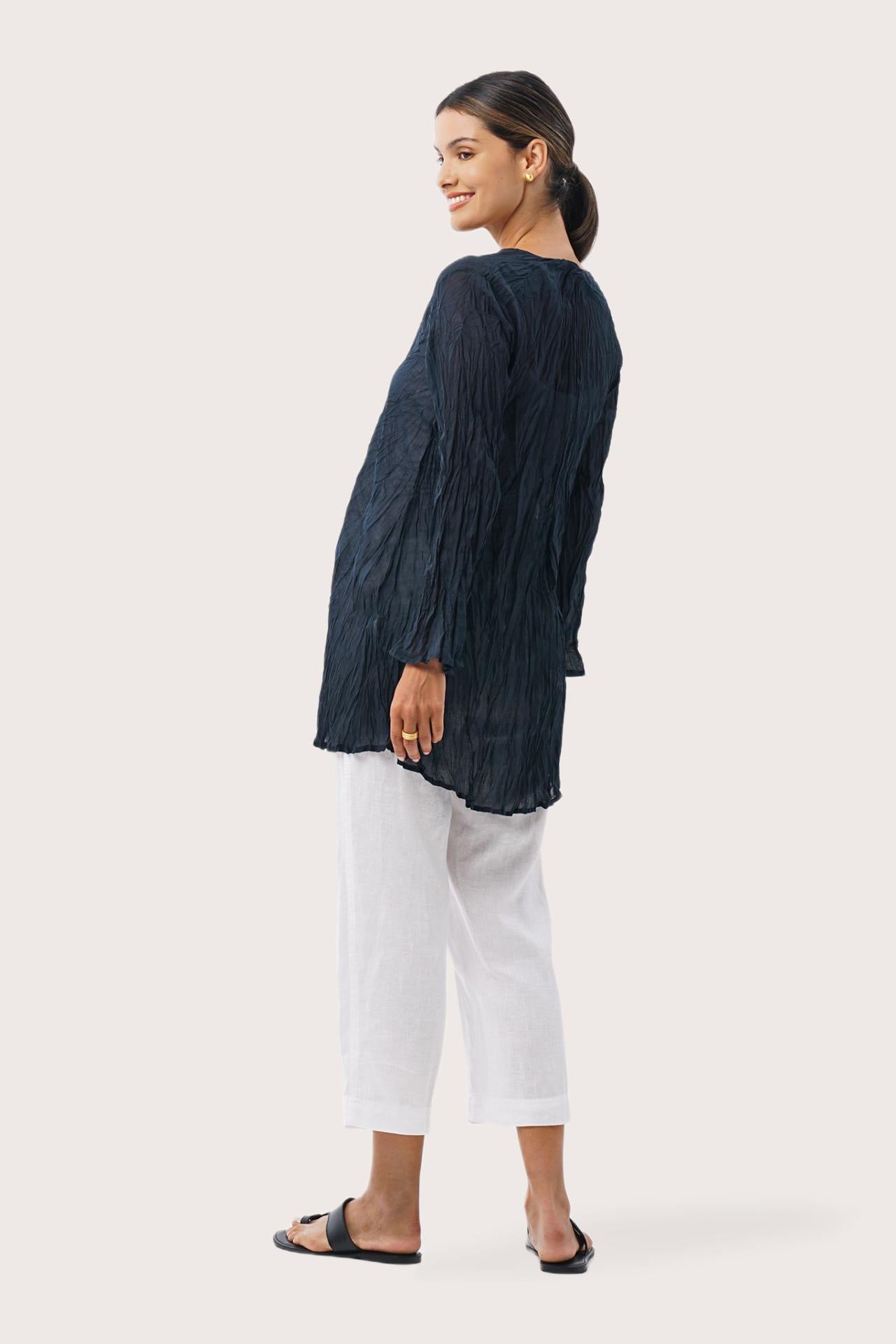 Back view of the Ravenna Cotton Outerwear Blue highlighting the garment shape and drape