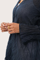 Close up detail of the Ravenna Cotton Outerwear Blue highlighting craftsmanship and design features