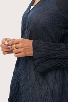 Close up detail of the Ravenna Cotton Outerwear Blue highlighting craftsmanship and design features