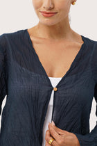 Close up detail of the Ravenna Cotton Outerwear Blue highlighting craftsmanship and design features