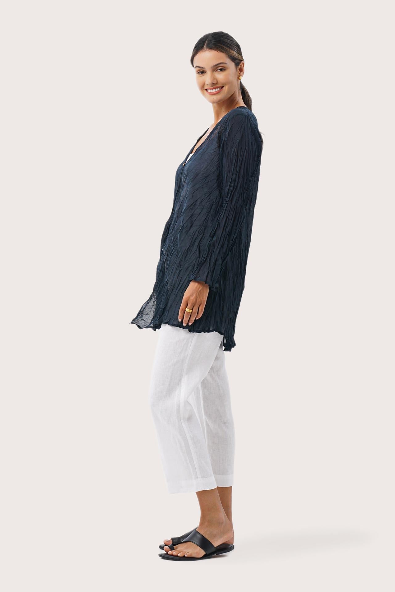 Side profile of the Ravenna Cotton Outerwear Blue showing its cut and natural movement