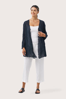 Woman wearing the Ravenna Cotton Outerwear Blue designed for effortless resortwear and tropical living by By The Sea Bali