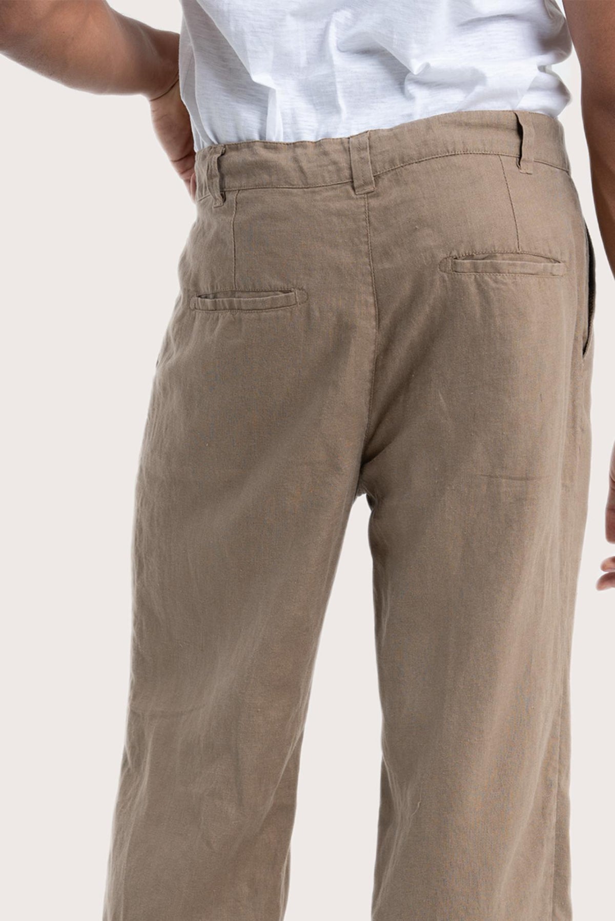 Detailed back view highlighting the relaxed silhouette and linen craftsmanship