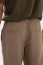 Detailed back view highlighting the relaxed silhouette and linen craftsmanship