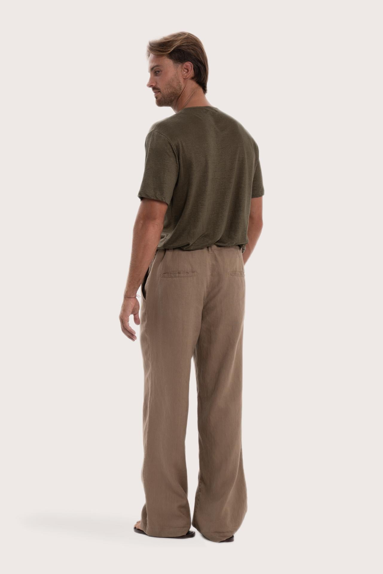 Back view of the cream linen pants with a relaxed and elegant silhouette