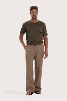 Model wearing the cream linen Rosca pants by By The Sea Bali