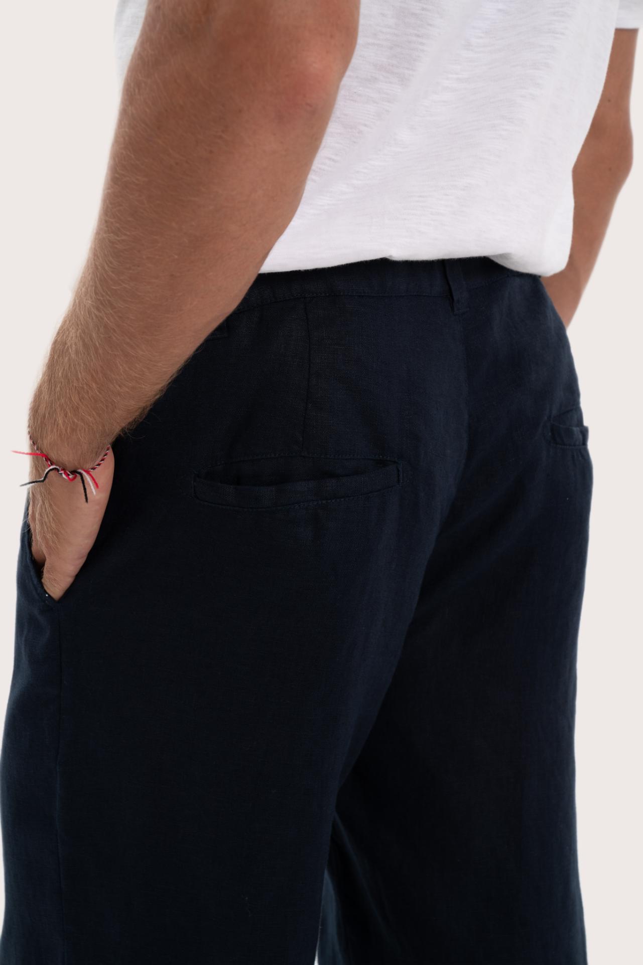 Detailed back view highlighting the relaxed silhouette and linen craftsmanship