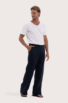 Side profile of the navy linen Rosca pants showcasing their effortless drape