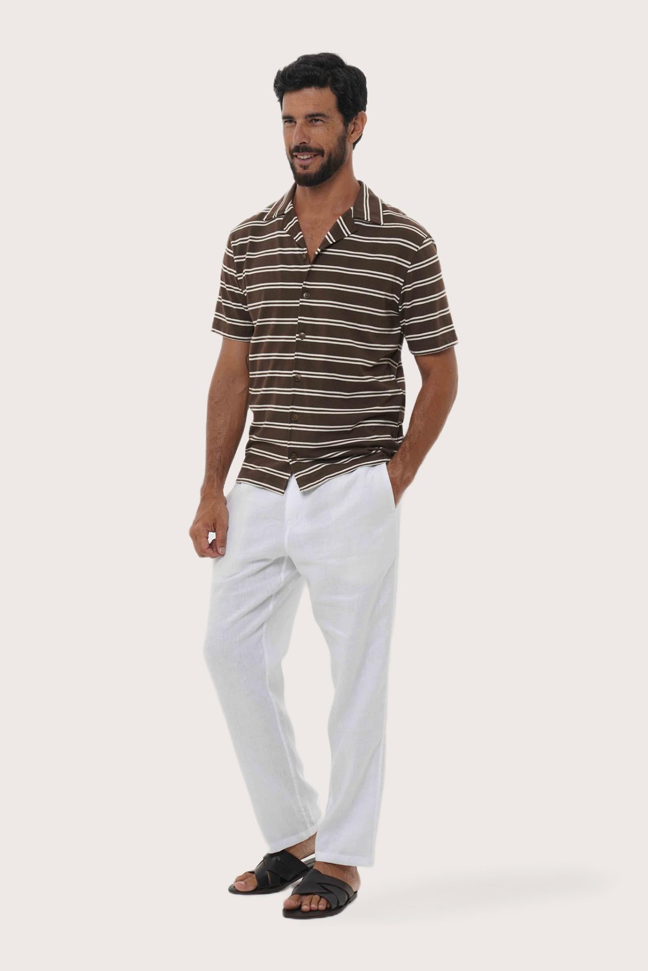 Side-angle view of the Salur Shirt Double Stripe in Brown showing its relaxed drape by By The Sea Bali