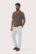 Side-angle view of the Salur Shirt Double Stripe in Brown showing its relaxed drape by By The Sea Bali