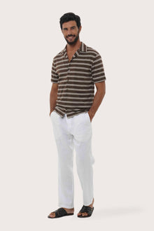 Side profile of the Salur Shirt Double Stripe in Brown highlighting its easy, breathable fit by By The Sea Bali