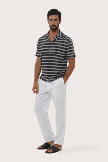 Side profile of the Salur Shirt Double Stripe in Grey Brown highlighting its easy, breathable fit by By The Sea Bali