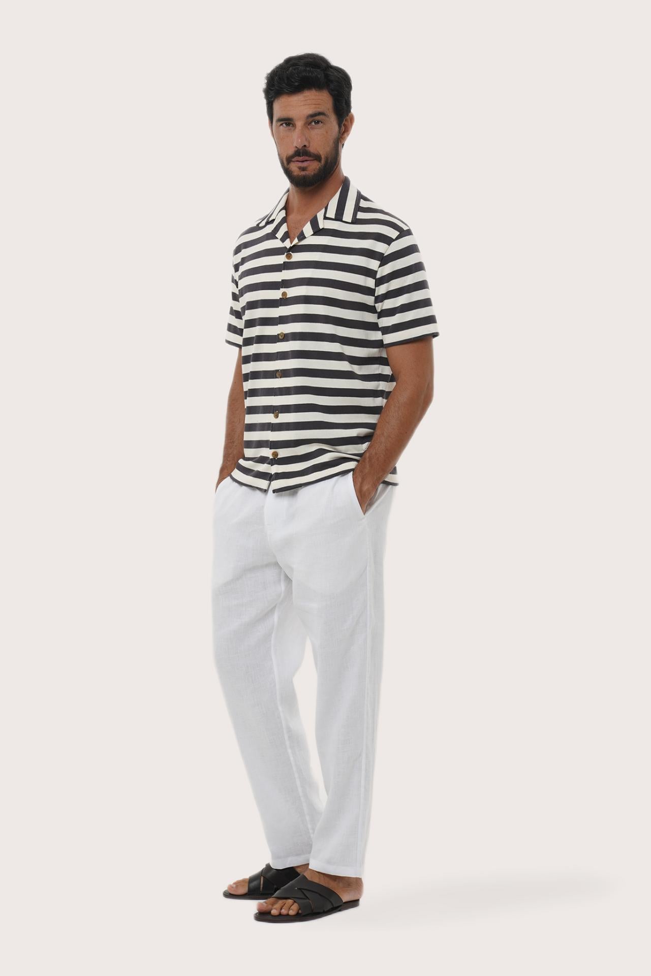 Side profile of the Salur Shirt Stripe in Grey Brown highlighting its easy, breathable fit by By The Sea Bali