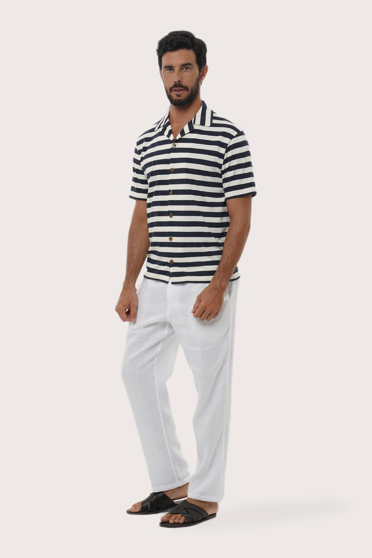 Side profile of the Salur Shirt Stripe in Navy highlighting its easy, breathable fit by By The Sea Bali