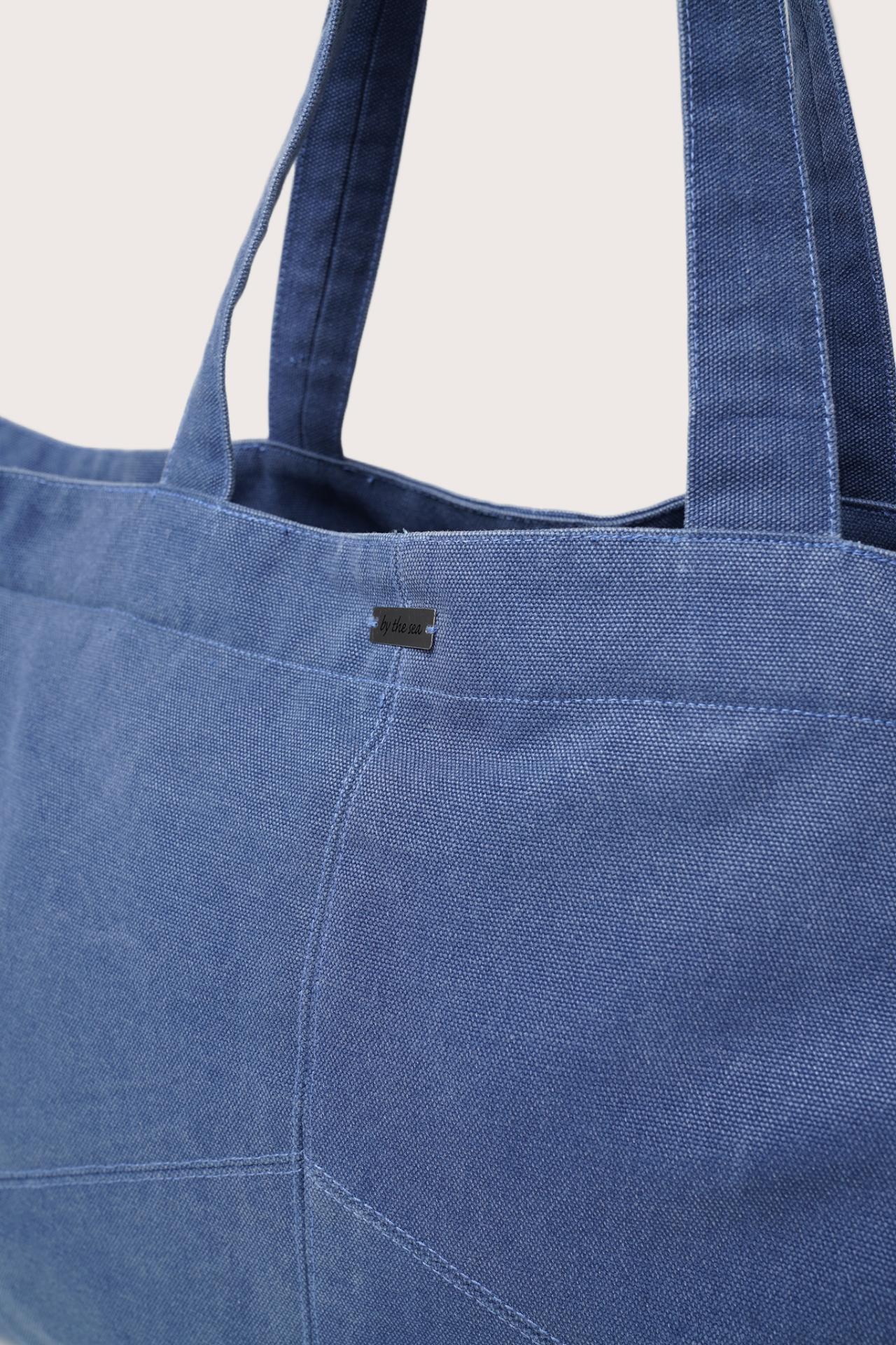 Close-up detail of the Sarcha Tote Bag highlighting premium materials and refined finishing
