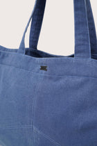 Close-up detail of the Sarcha Tote Bag highlighting premium materials and refined finishing