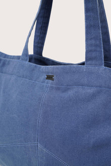 Close-up detail of the Sarcha Tote Bag highlighting premium materials and refined finishing