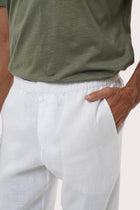 Side profile of the Sargi Linen Pant in White highlighting the clean regular fit by By The Sea Bali