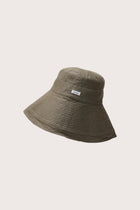 Side view of the Savanna Linen Hat Brown highlighting its soft linen structure and relaxed shape