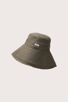 Side view of the Savanna Linen Hat Brown highlighting its soft linen structure and relaxed shape