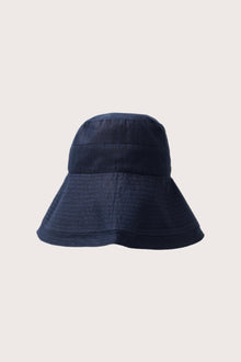 Full view of the Savanna Linen Hat Navy capturing its timeless silhouette and resort-ready aesthetic