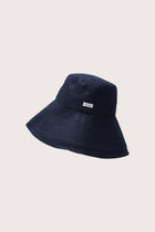 Side view of the Savanna Linen Hat Navy highlighting its soft linen structure and fluid brim
