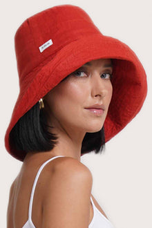 Full view of the Savanna Linen Hat Red capturing its timeless resort aesthetic and lightweight silhouette