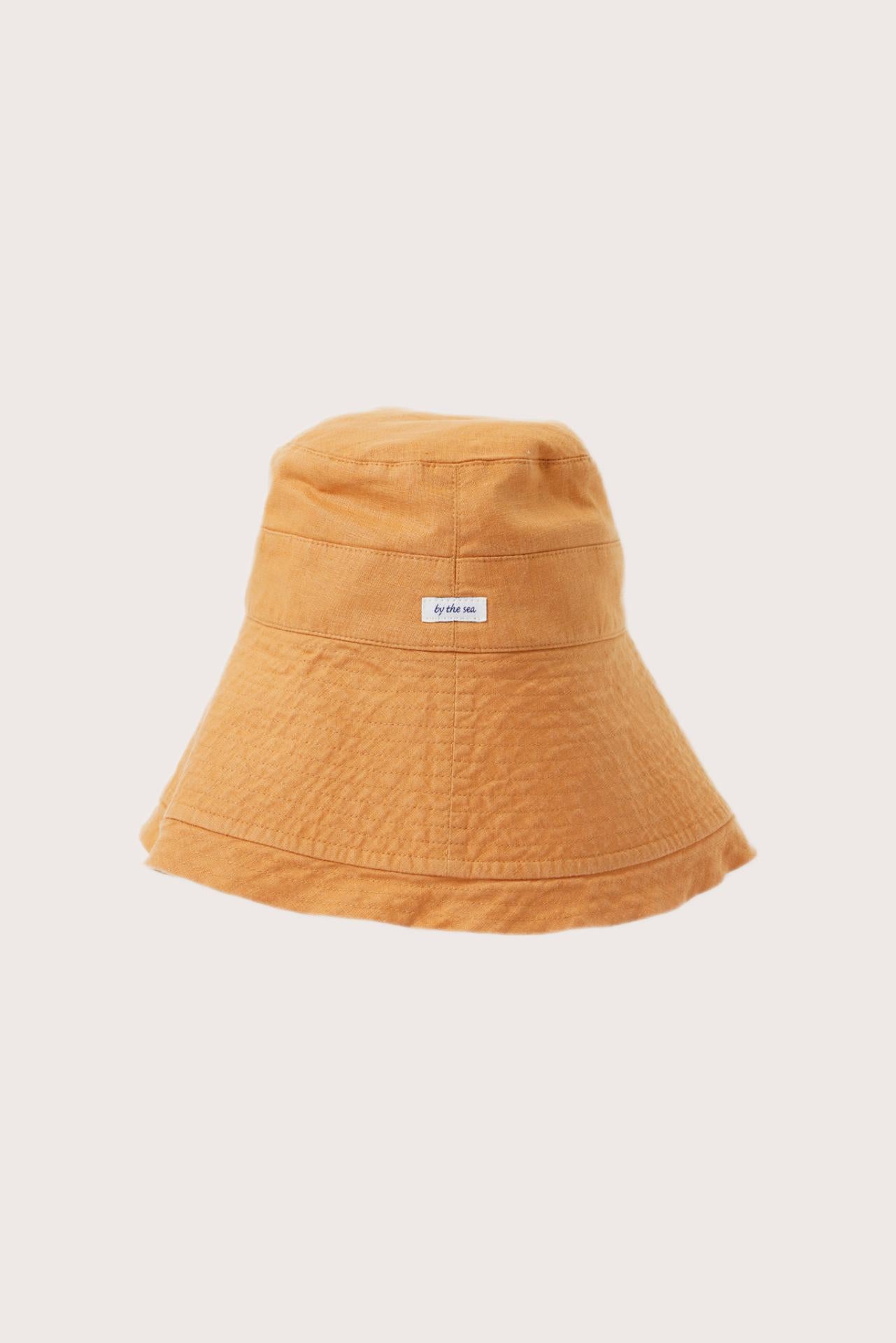 By The Sea Bali Savanna Linen Hat in yellow with an elegant wide-brim resort silhouette