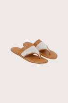 Savanna sandals in brown front view showcasing elegant straps and minimalist resort aesthetic