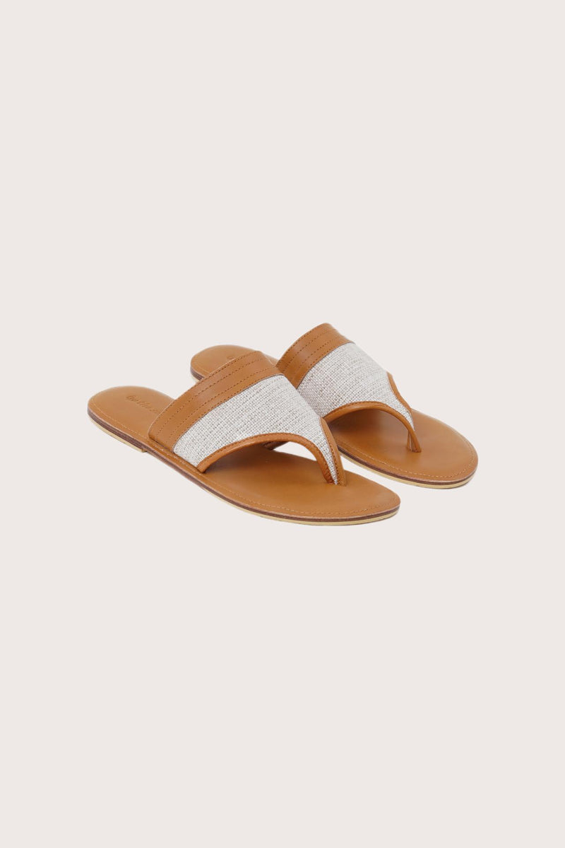 Savanna sandals in brown front view showcasing elegant straps and minimalist resort aesthetic