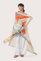 By The Sea Bali Savaya Sarong in Bamboo Paint Yellow Orange worn as an elegant wrap silhouette