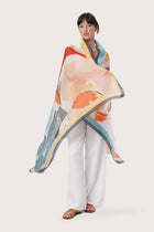 By The Sea Bali Savaya Sarong in Bougenville Multicolor worn as an elegant wrap silhouette