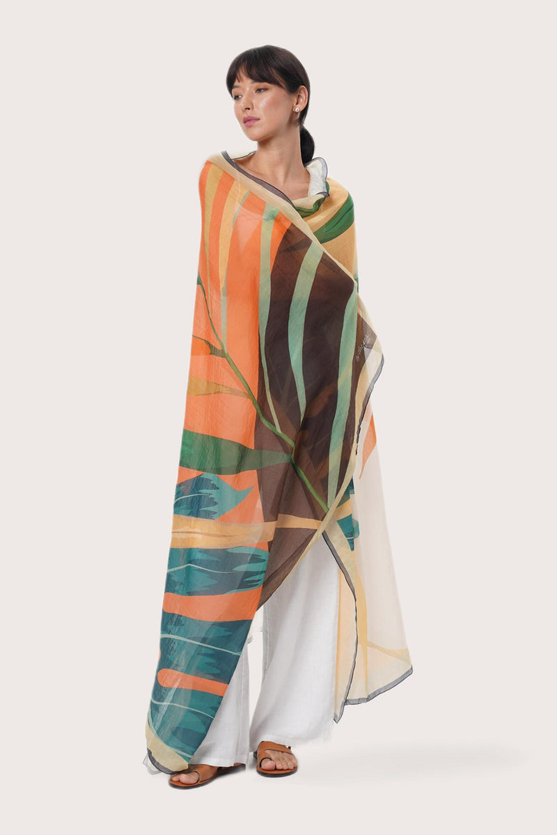 By The Sea Bali Savaya Sarong in Summer Palm Green featuring a tropical palm-inspired print, worn as an elegant wrap silhouette