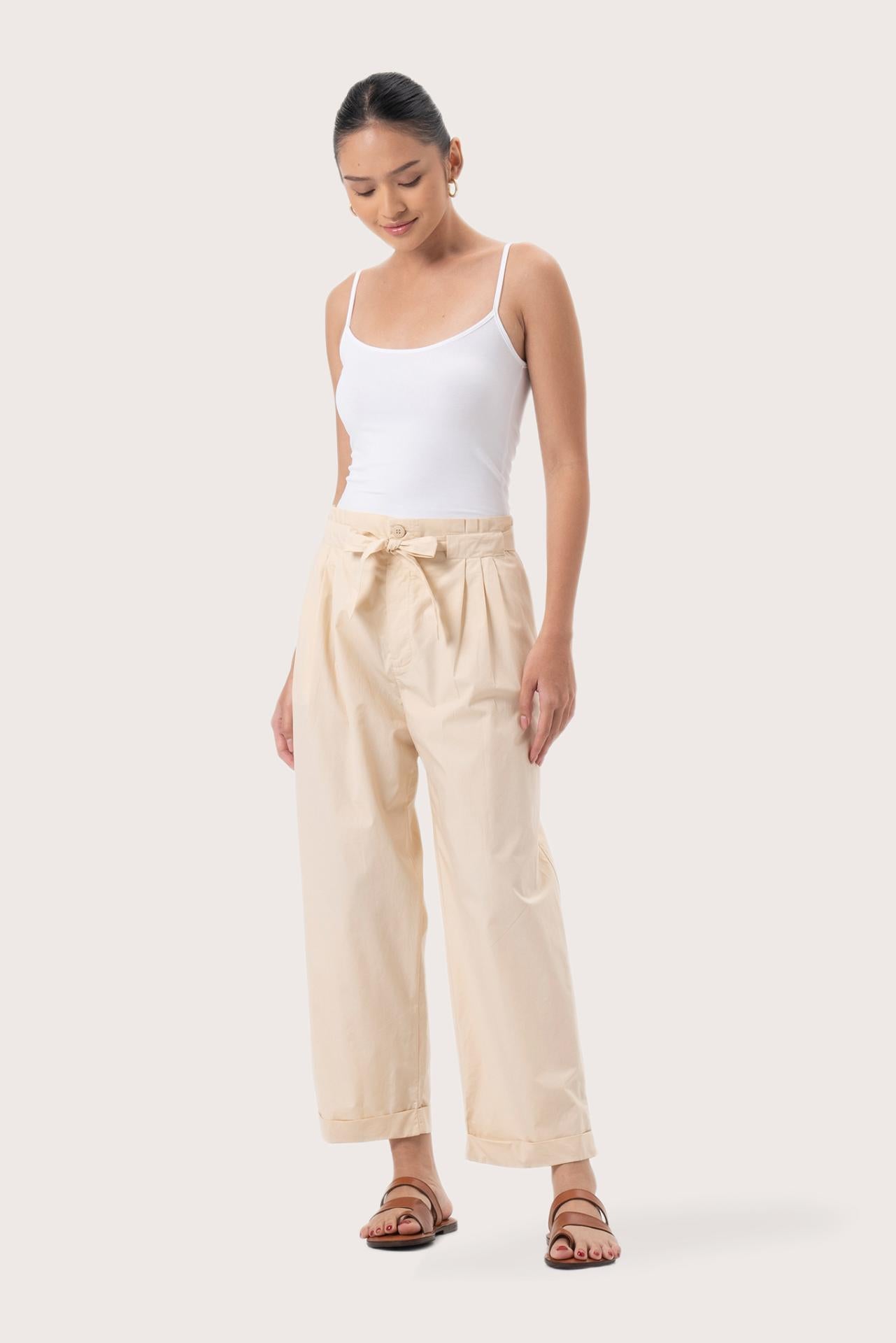 Woman wearing the Sawangan Cotton Pants Cream designed for effortless resortwear and tropical living by By The Sea Bali.