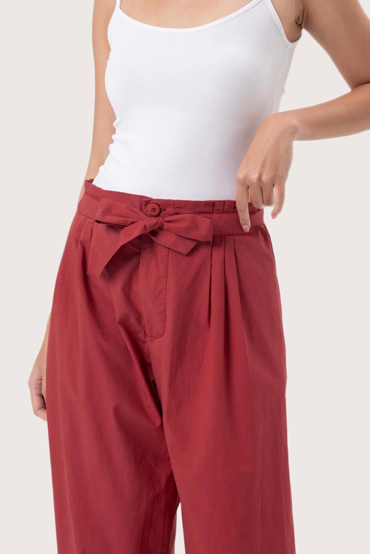 Close up detail of the Sawangan Cotton Pants Maroon highlighting craftsmanship and design features.