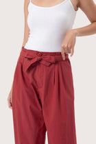 Close up detail of the Sawangan Cotton Pants Maroon highlighting craftsmanship and design features.