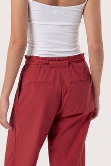 Close up detail of the Sawangan Cotton Pants Maroon highlighting craftsmanship and design features.
