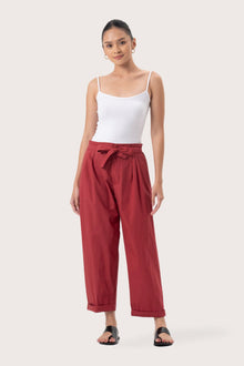 Woman wearing the Sawangan Cotton Pants Maroon designed for effortless resortwear and tropical living by By The Sea Bali.