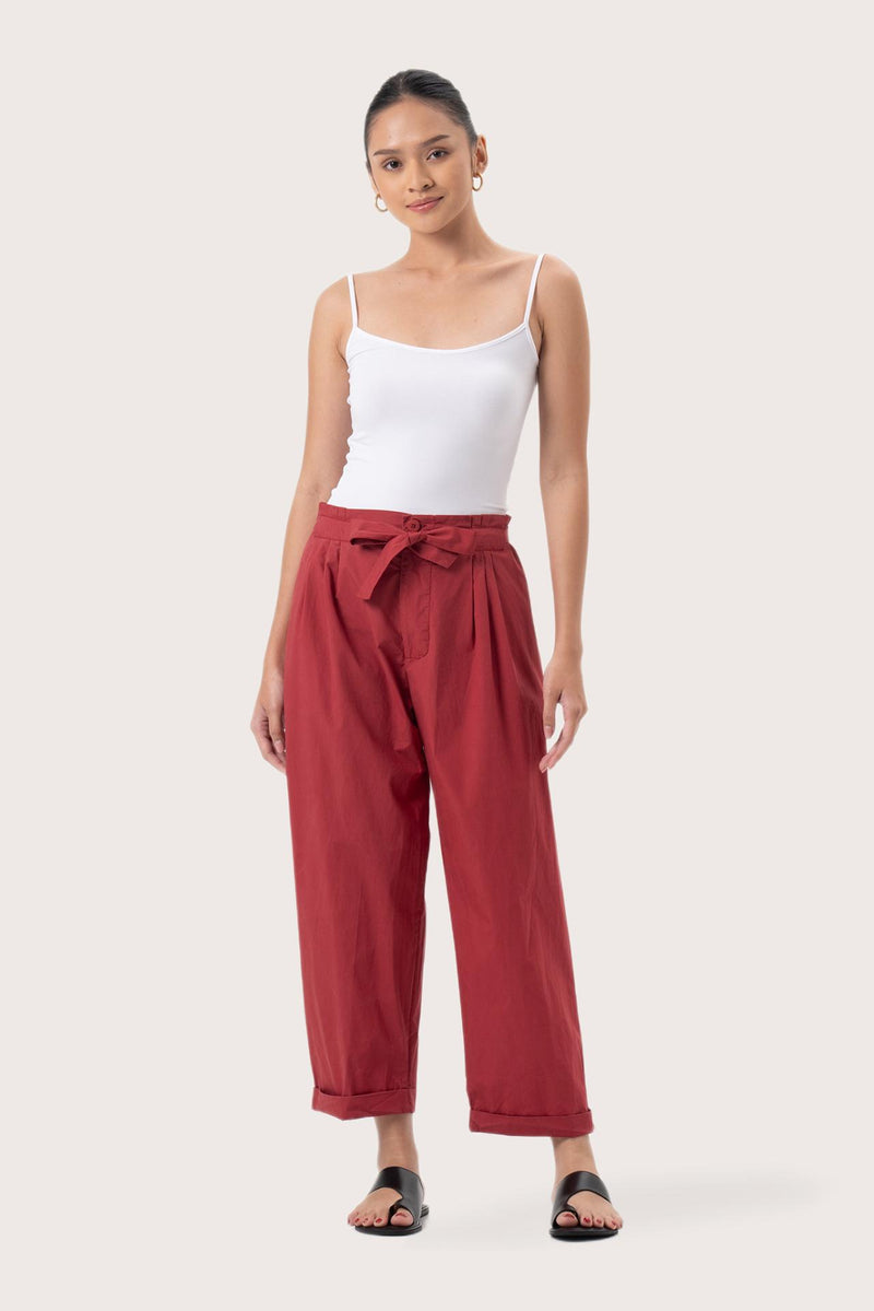 Woman wearing the Sawangan Cotton Pants Maroon designed for effortless resortwear and tropical living by By The Sea Bali.
