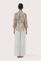 Back view of the Selva Shirt Crisante Multicolor Light Blue Base highlighting the garment shape and drape.