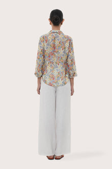 Back view of the Selva Shirt Crisante Multicolor Light Blue Base highlighting the garment shape and drape.
