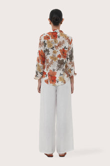 Back view of the Selva Shirt Raya highlighting the garment shape and drape.