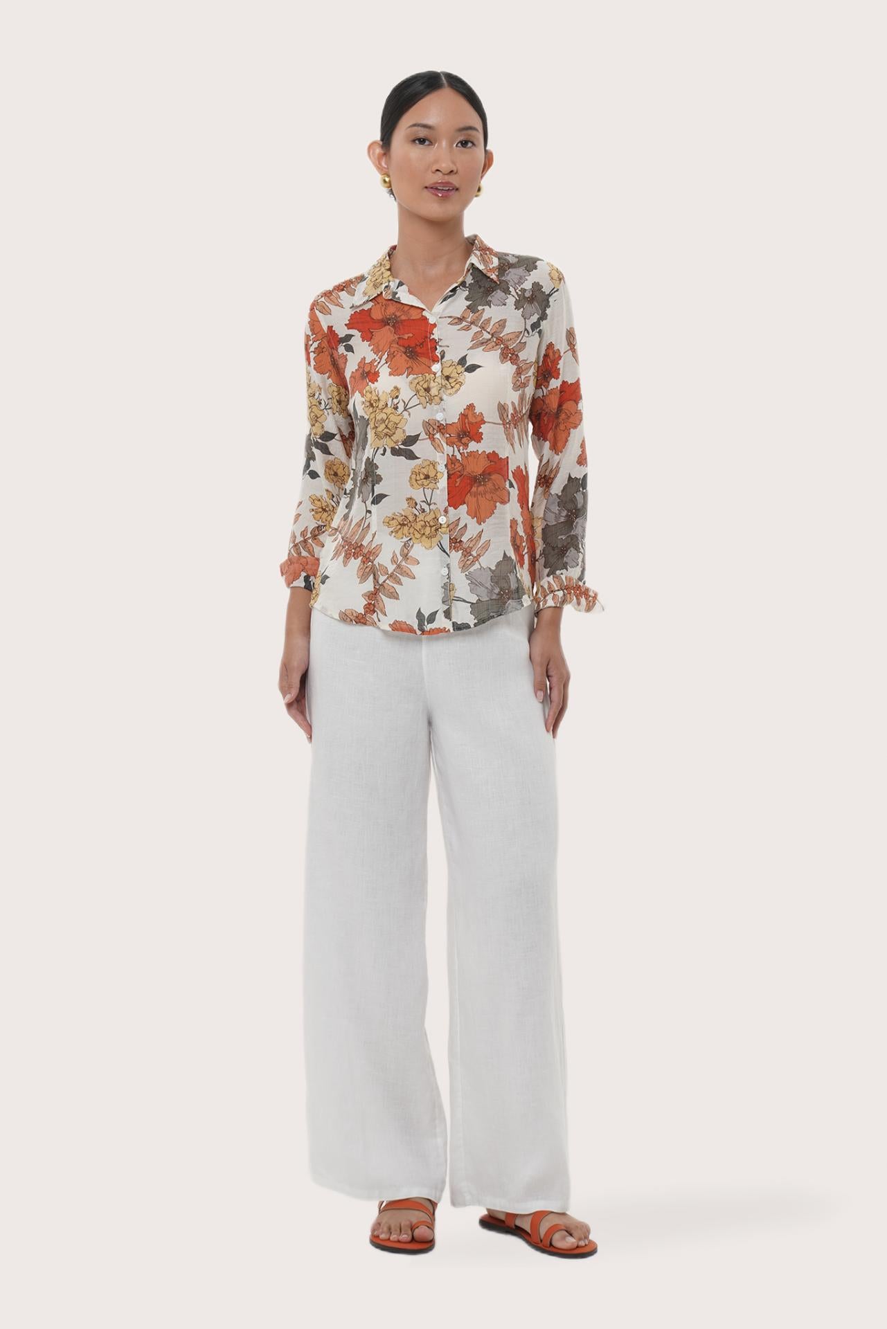 Woman wearing the Selva Shirt Raya designed for effortless resortwear and tropical living by By The Sea Bali.