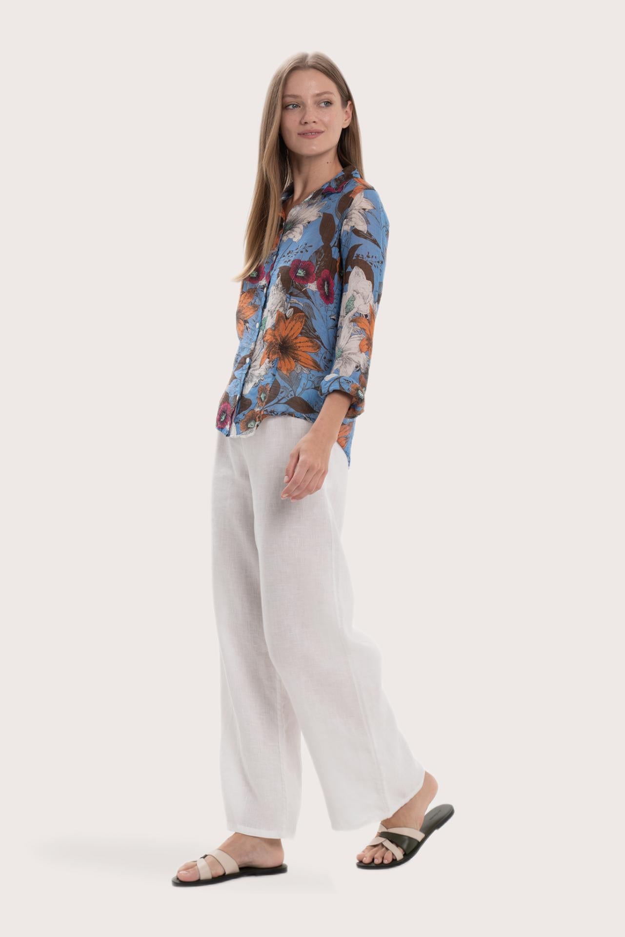 Side profile of the navy base multicolor Daisy shirt showcasing its lightweight drape