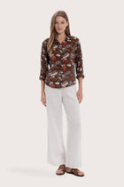 Model wearing the brown base multicolor Marigold Selva shirt by By The Sea Bali