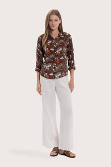 Model wearing the brown base multicolor Marigold Selva shirt by By The Sea Bali