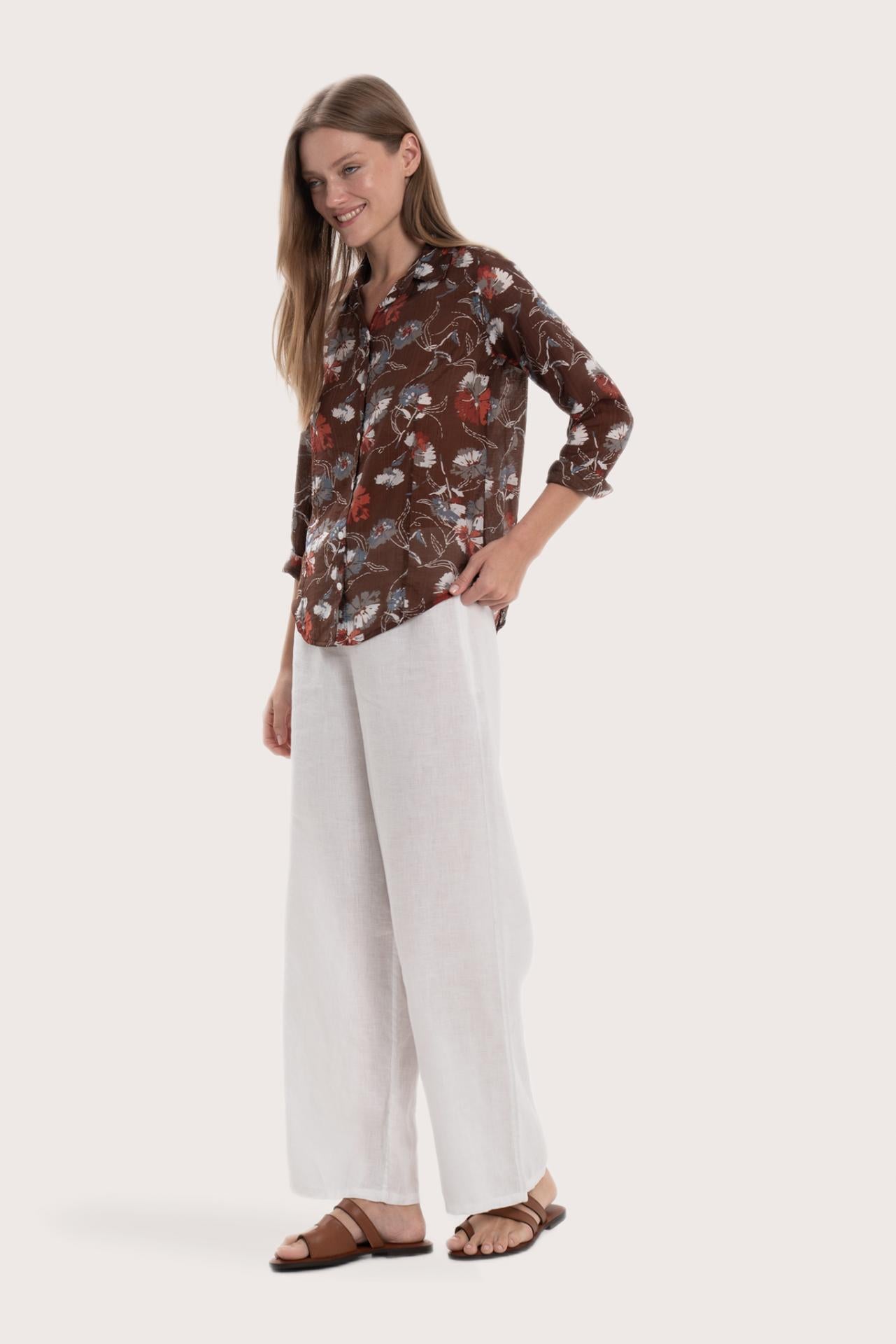 Side profile of the brown base multicolor Marigold shirt showcasing its lightweight drape