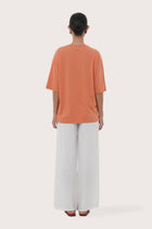 By The Sea Bali Back view of the Serva Loose T-Shirt in Orange Brick