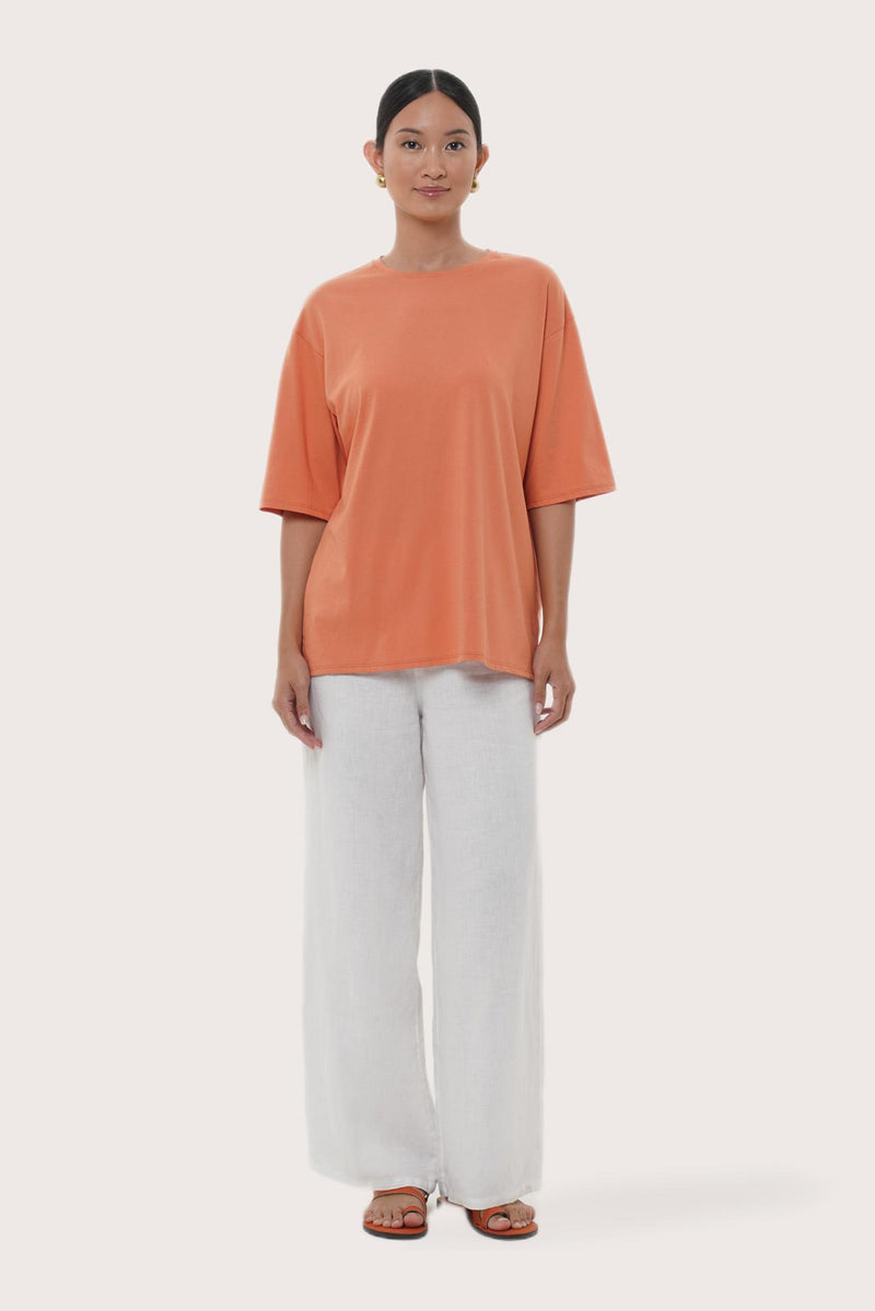 By The Sea Bali Serva Loose T-Shirt in Orange Brick featuring a relaxed silhouette and effortless resort style
