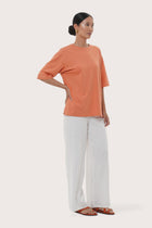 By The Sea Bali Side profile of the Serva Loose T-Shirt showcasing its relaxed fit and soft drape
